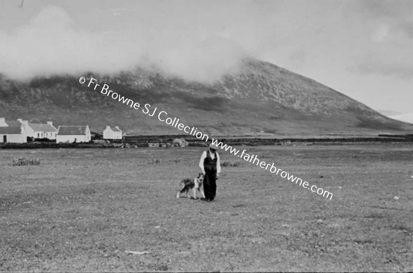 KEEL STRAND FROM RICHVIEW HOTEL WITH MAN AND DOG